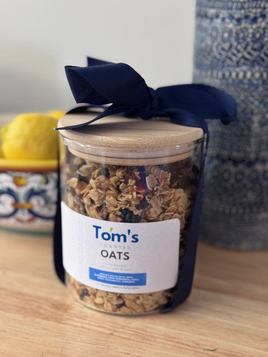 Limited Edition Trial Size 12 oz Tom's Toasted Oats. Reusable glass jar with bamboo lid.